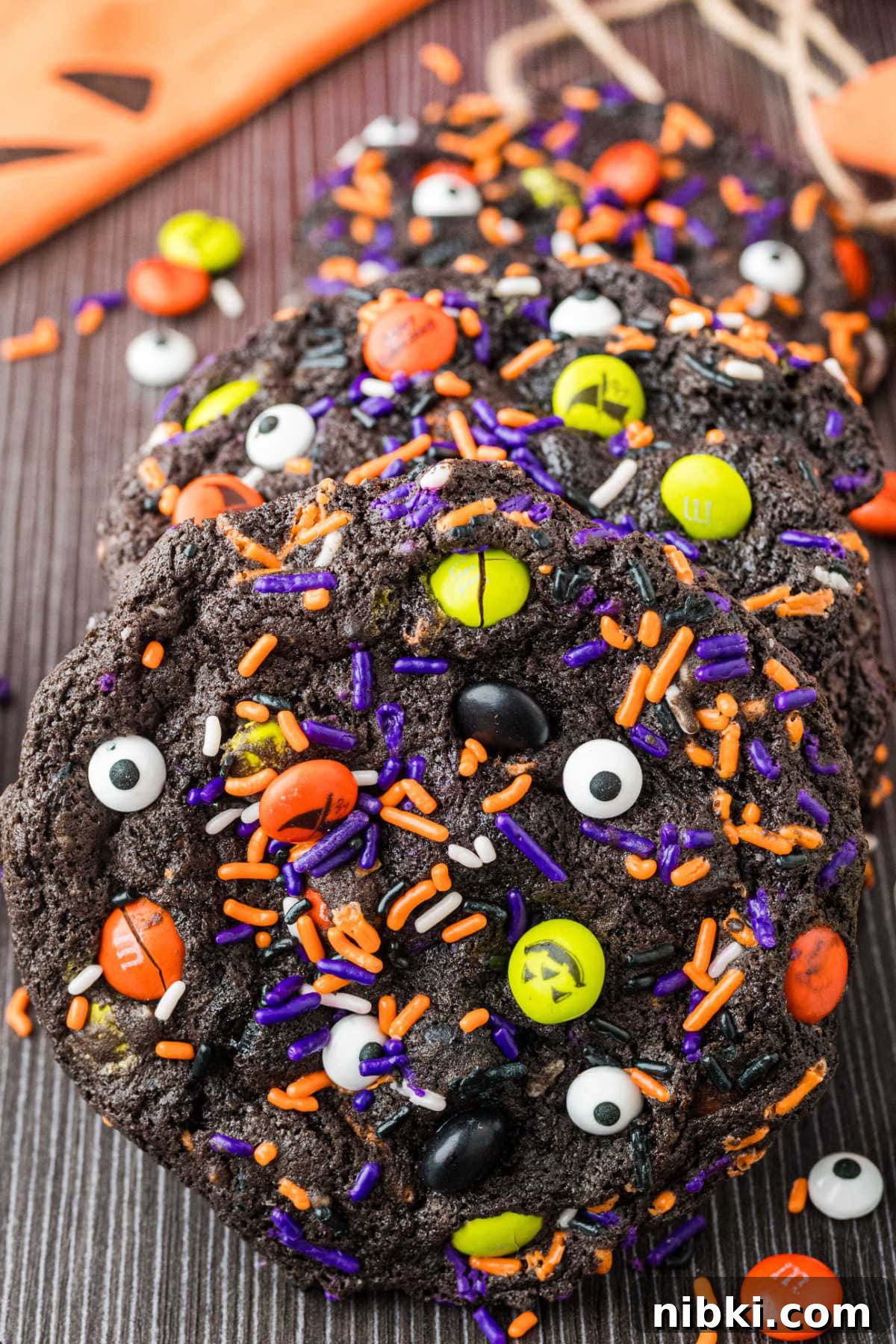 Spooky Halloween Cookie Recipes and Decorating Ideas 2 Halloween cookies on a dark surface.