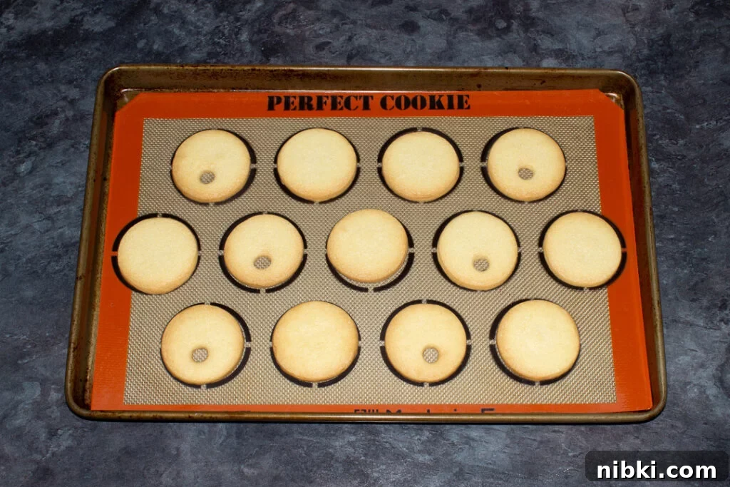 Baked cookies on a lined baking sheet