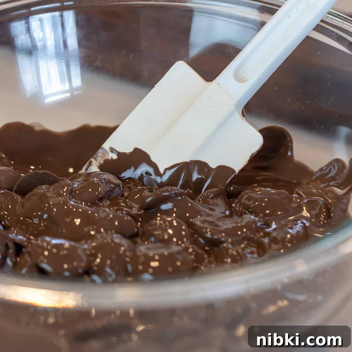 St. Patrick's Day Leprechaun Chocolate Bark Recipe 4 A bowl of melted candy melts stirred with a rubber spatula.