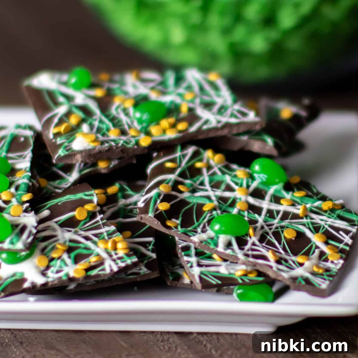St. Patrick's Day Leprechaun Chocolate Bark Recipe 7 A close up plate of broken bark.