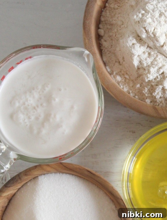 How to Make Dairy-Free Buttermilk That Bakes Like the Real Thing 2 measuring cup of buttermilk on a counter