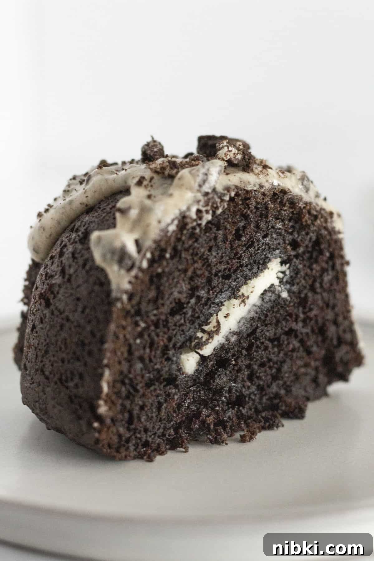 A slice of Oreo Bundt cake on a white plate.