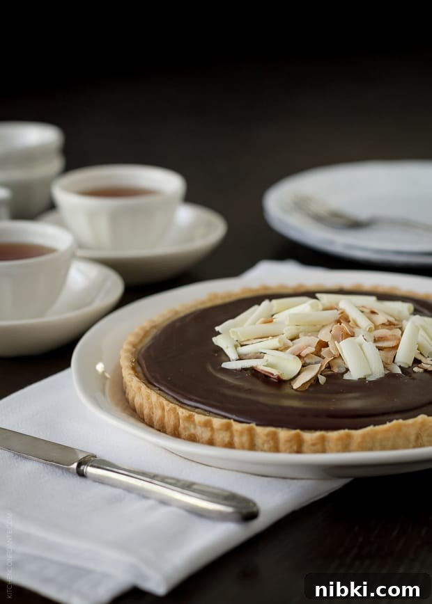 Coconut Custard Tart with Chocolate Ganache Recipe 6 White chocolate curls and toasted coconut topping a Coconut Tart.