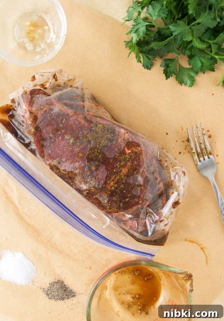 Garlic Herb Ribeye Steak Marinade for Grilling 8 Steaks in marinade in a plastic bag