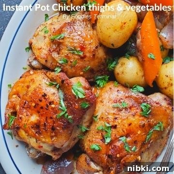 pressure cooked skin on chicken thighs, baby potatoes, carrots in a white plate garnished with chopped parsley