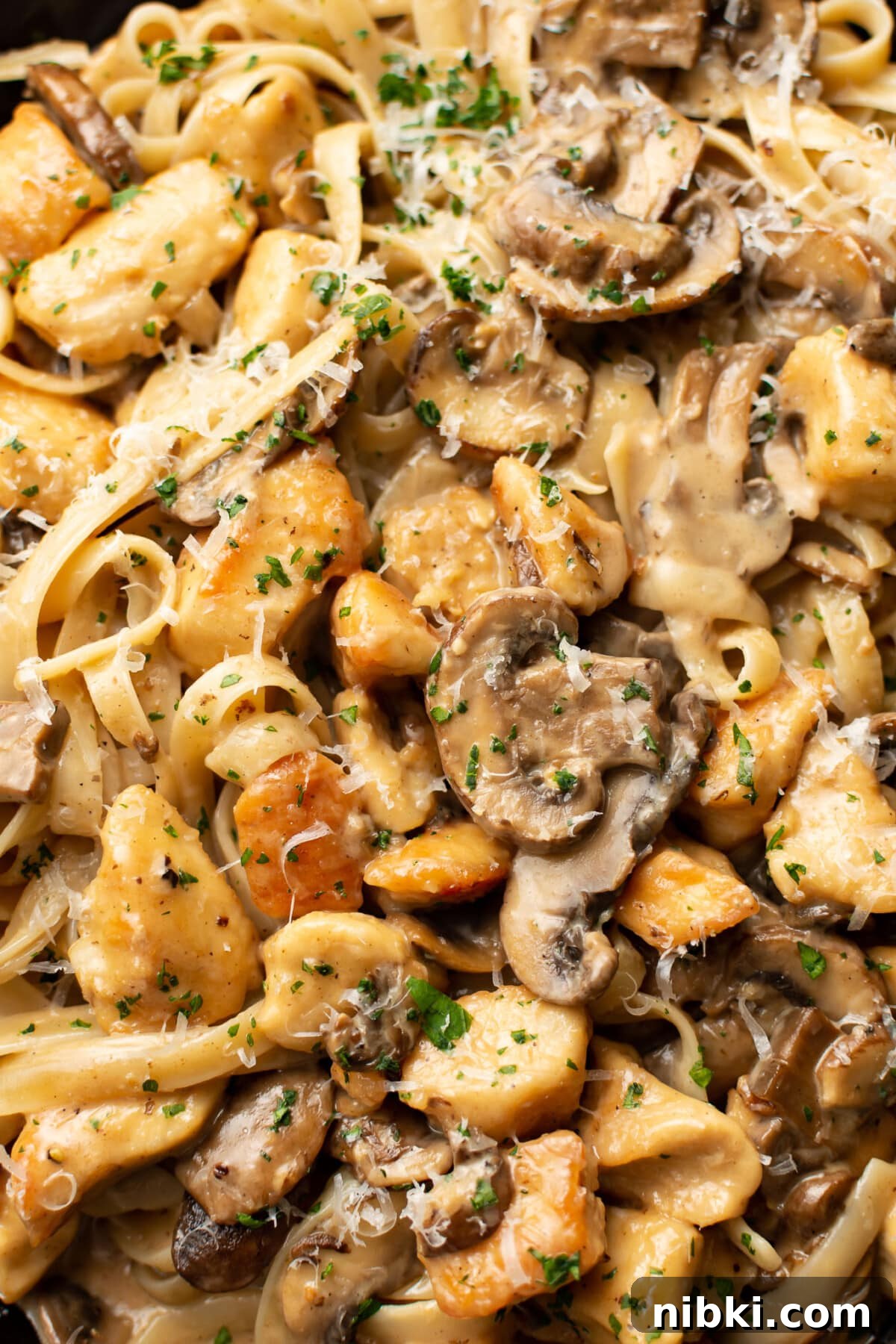 Creamy Chicken Marsala Pasta with Mushrooms 6 closeup of chicken marsala pasta in a skillet