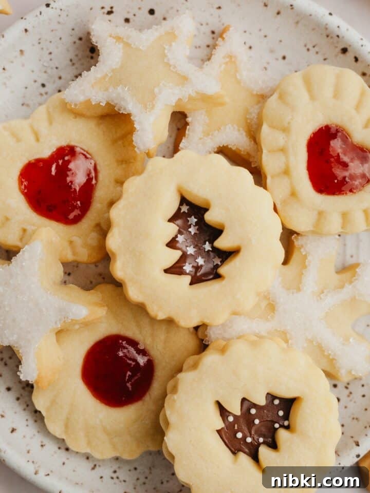 A small plate with shortbread cookies in different shapes.