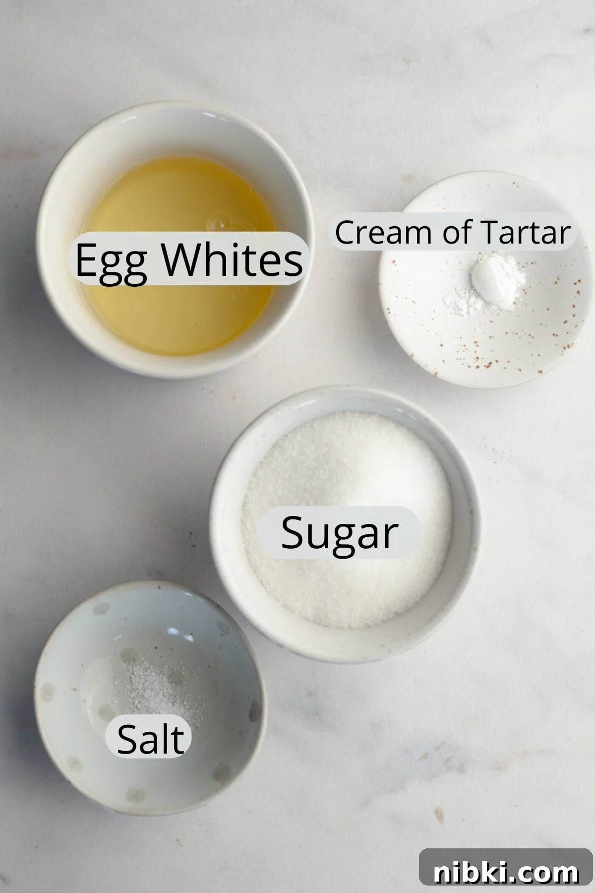 The ingredients needed to make meringue mushrooms, weighed out into small bowls.