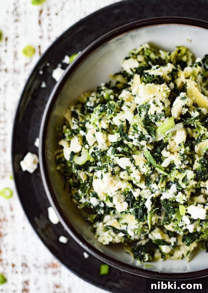 Spinach Puffs Recipe: Flaky Puff Pastry Bites 3 Spinach and artichoke filling in a black and white bowl
