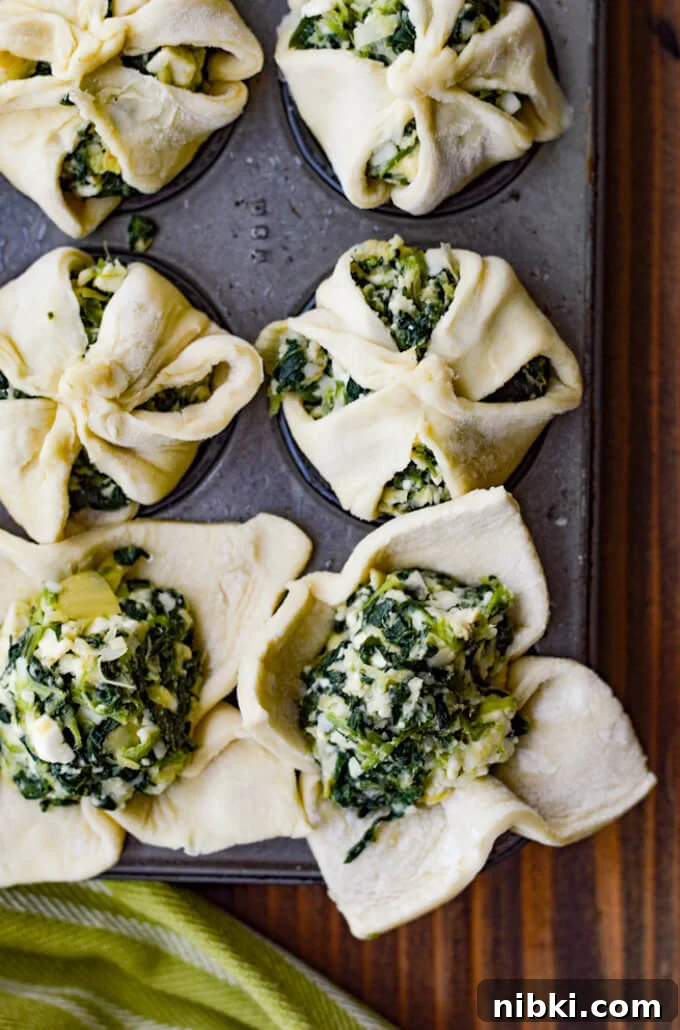 Spinach Puffs Recipe: Flaky Puff Pastry Bites 4 Unbaked puff pastry with spinach filling in mini muffin tins.