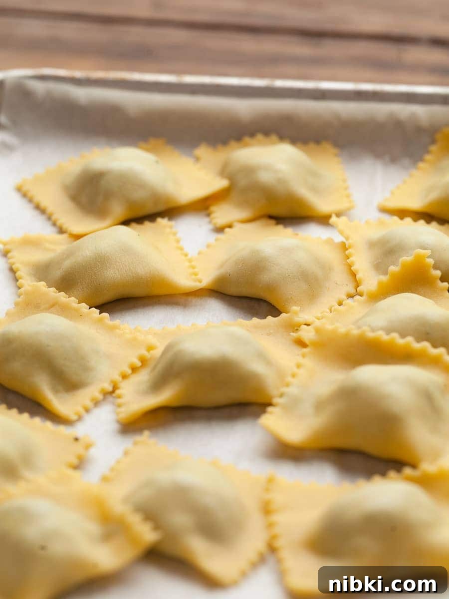Homemade Gluten-Free Spinach and Ricotta Ravioli 17 gluten free spinach ricotta ravioli on a sheet tray