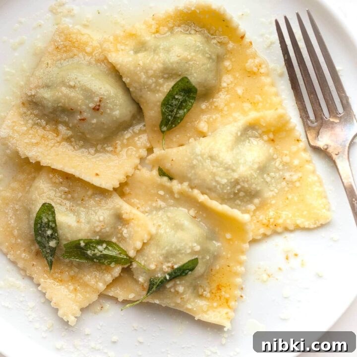 gluten free spinach ricotta ravioli on a plate with a fork
