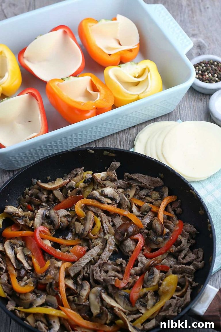Philly Cheesesteak Stuffed Peppers - Low-Carb, Gluten-Free 3 The first step is to cook the filling for our stuffed peppers, the peppers are waiting in a pan to be stuffed.