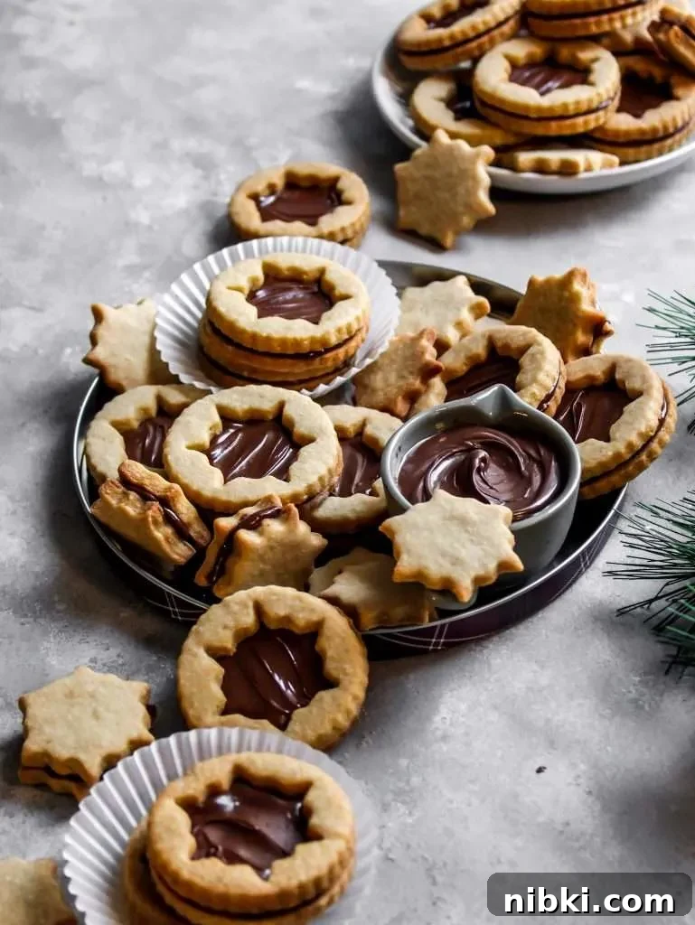 Nutella-Filled Linzer Cookies Recipe 13 filled Nutella Linzer cookies on serving platter (6)