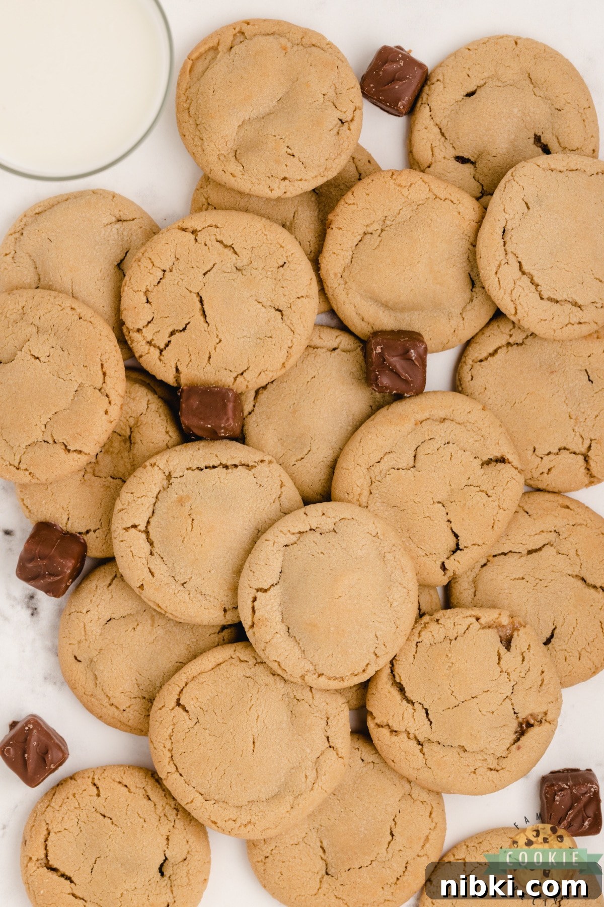Chewy Snickers Peanut Butter Cookies Recipe 2 Peanut Butter cookies with a Snickers in the middle