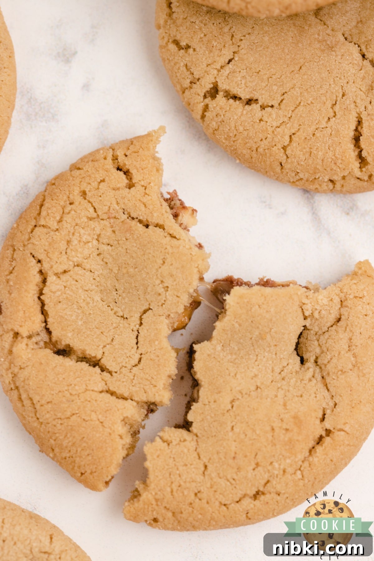 Chewy Snickers Peanut Butter Cookies Recipe 6 Peanut butter cookies with a miniature Snickers in the middle