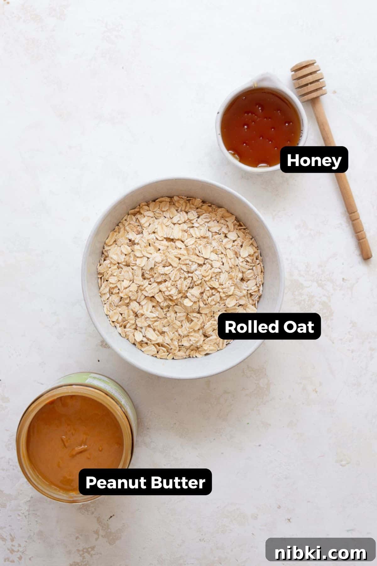 No-Bake Peanut Butter Oatmeal Protein Bites 3 Ingredients in no bake peanut butter oatmeal balls, including: natural peanut butter, honey, and rolled oats.
