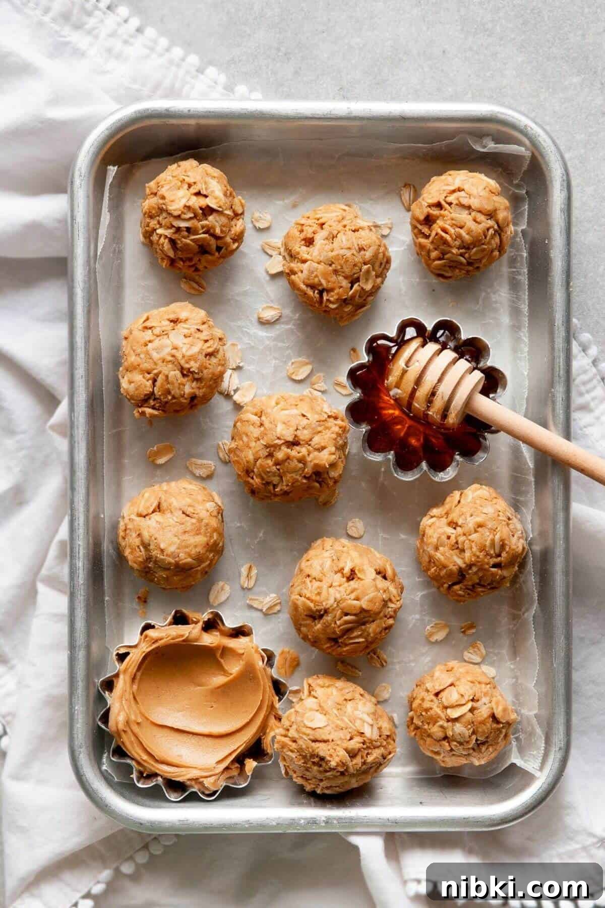 No-Bake Peanut Butter Oatmeal Protein Bites 6 healthy 3 ingredient peanut butter oatmeal balls on a tray