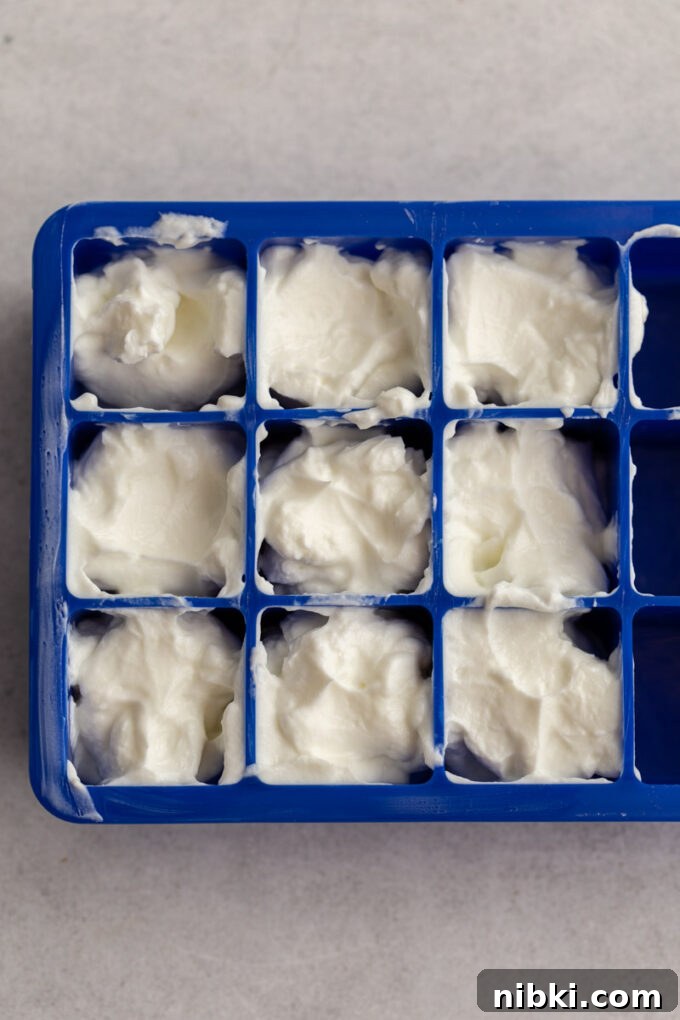 ice cube tray filled with sour cream