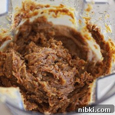 a blender full of a date paste that has been blended together