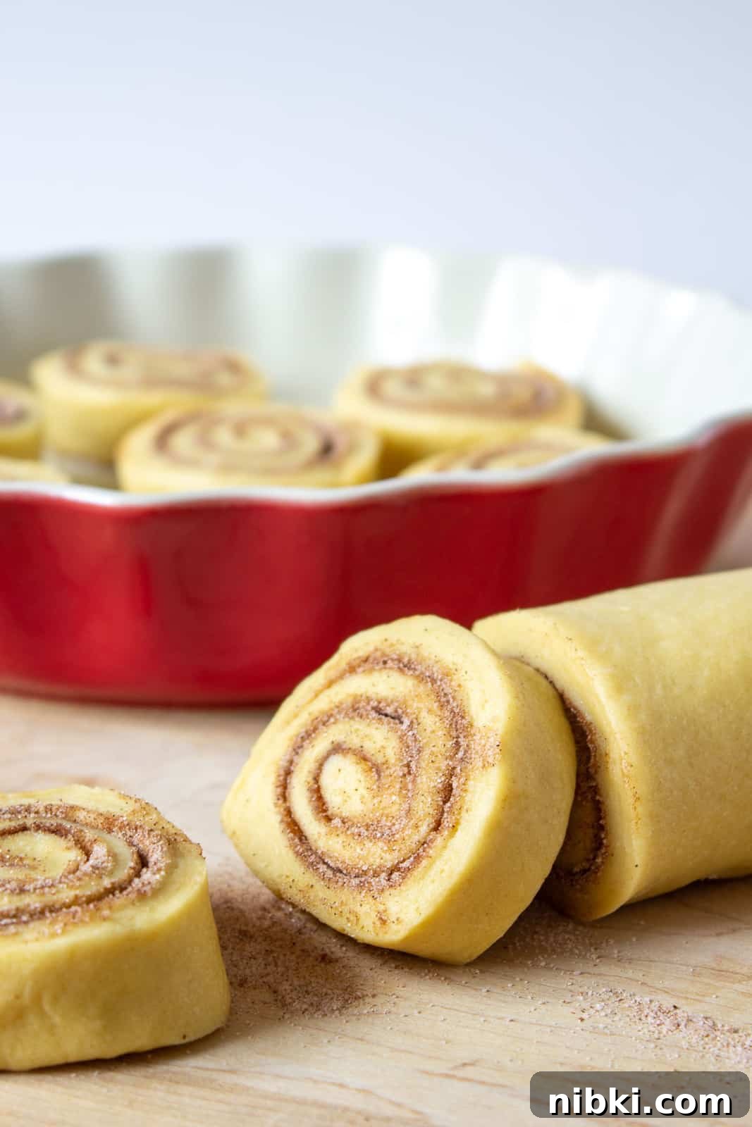 Homemade Cinnamon Rolls with Cream Cheese Frosting 3 Rolled dough filled with cinnamon and sugar.