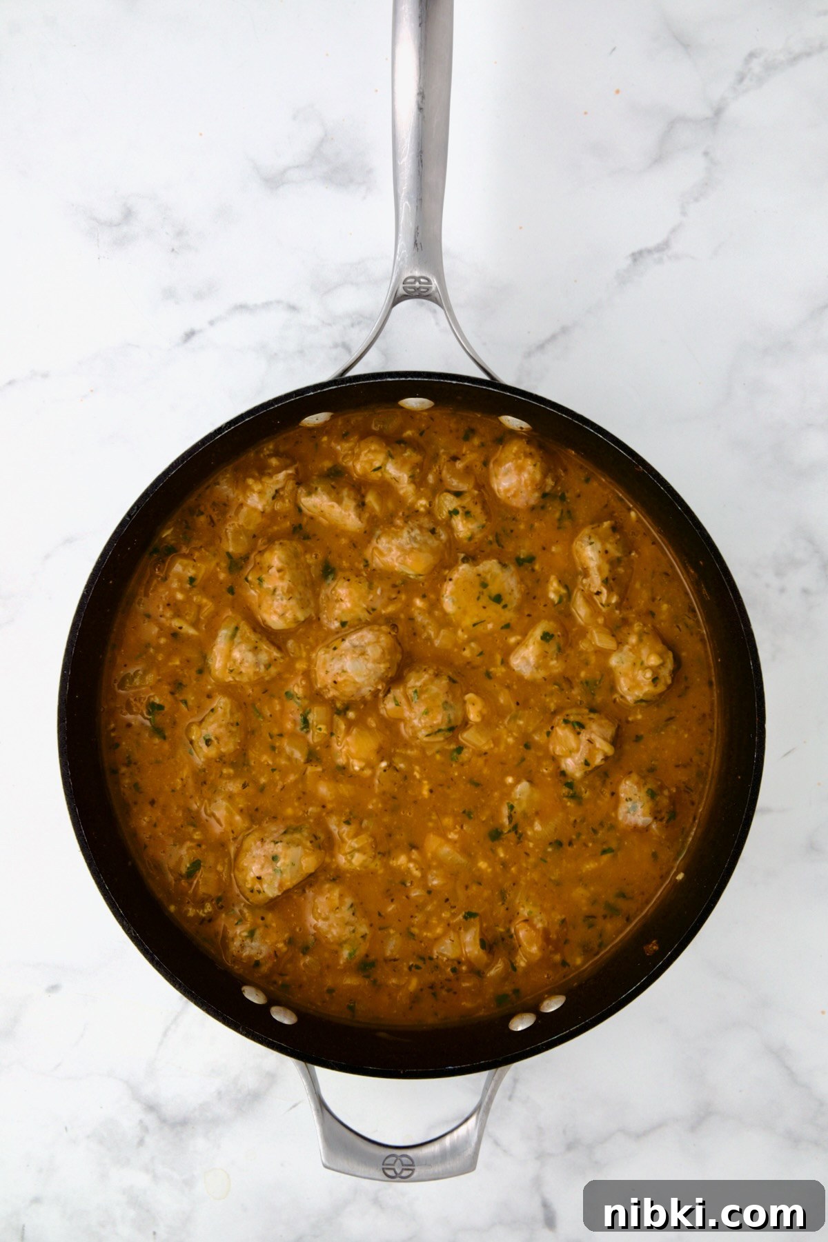 Oven-Baked Turkey Meatballs with Beer Glaze 14 Meatballs added back to sauce in nonstick skillet.