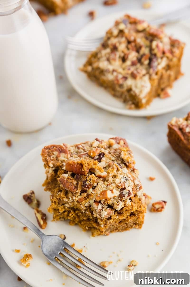 a side view of a slice of gingerbread coffee cake with a bite out