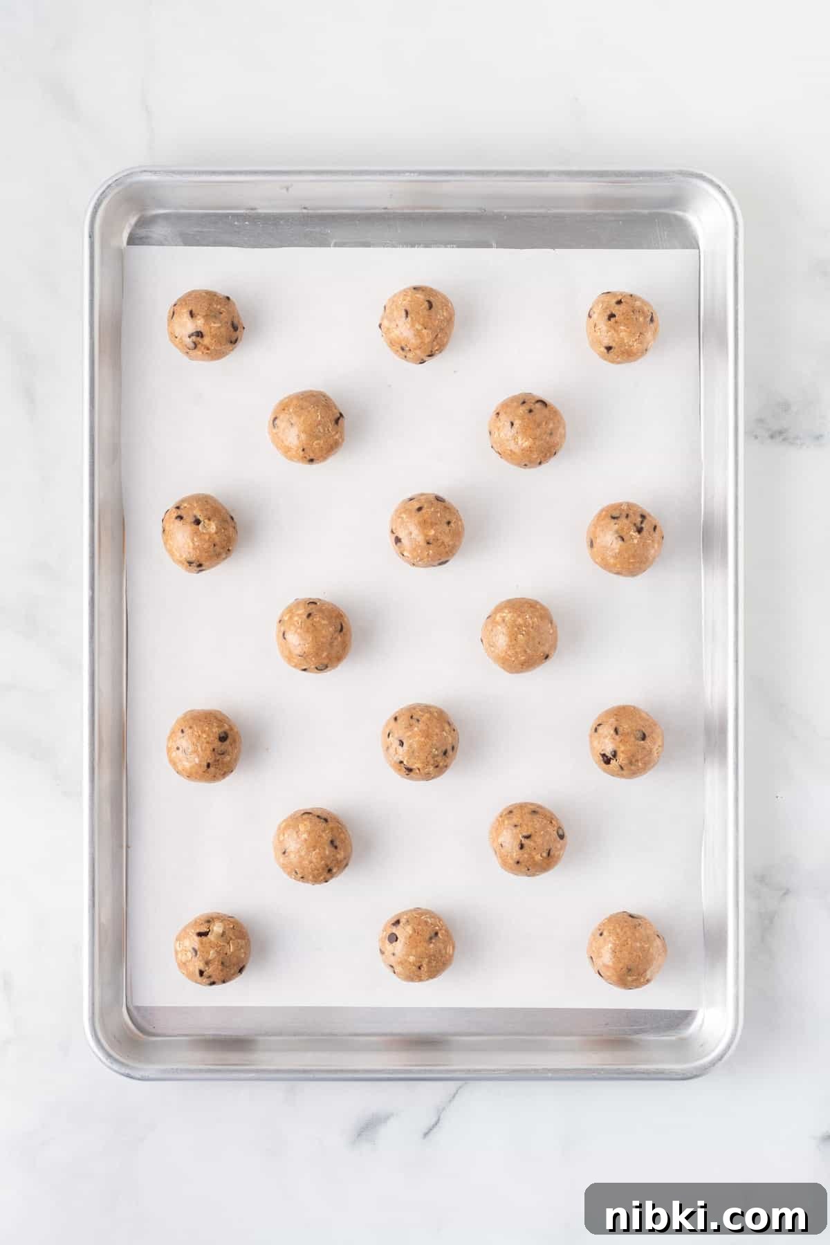almond butter energy balls on a baking sheet