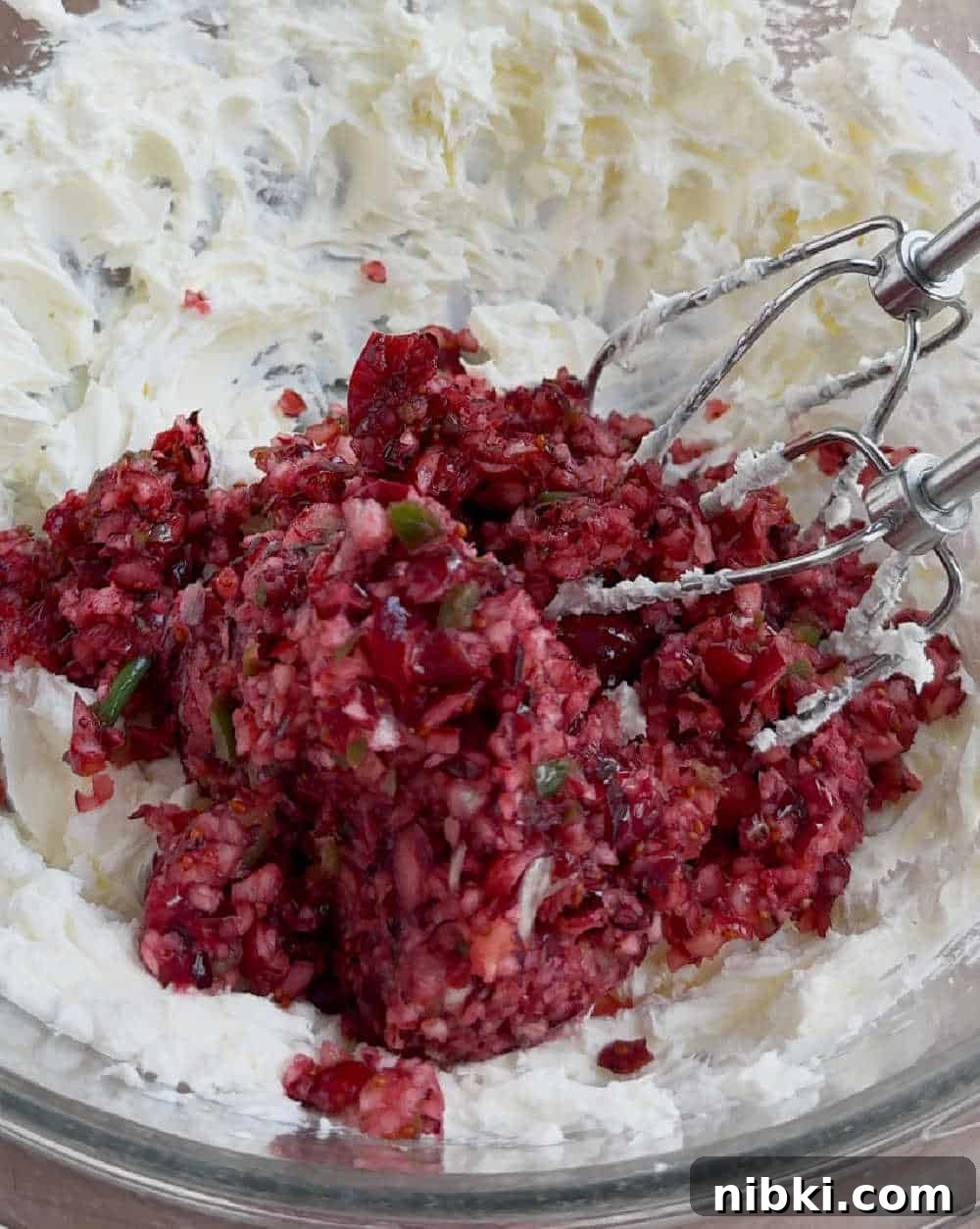 cranberry mixture and cream cheese in mixing bowl.