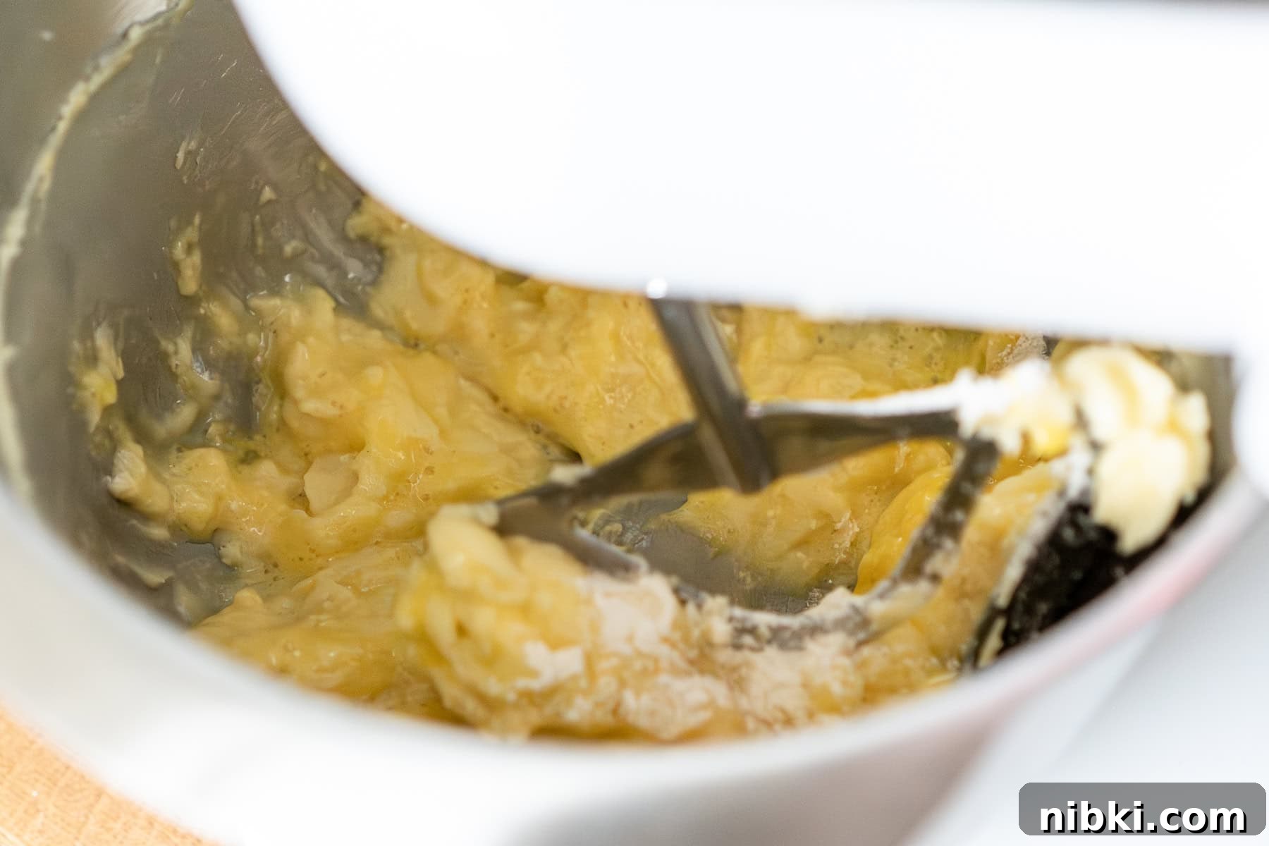 Fairy cake batter getting mixed with an electric mixer