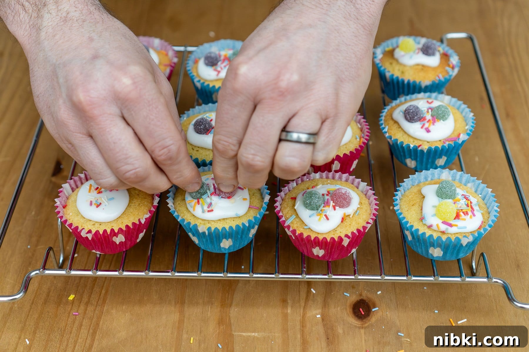 Place the sweets on top of the fairy cakes