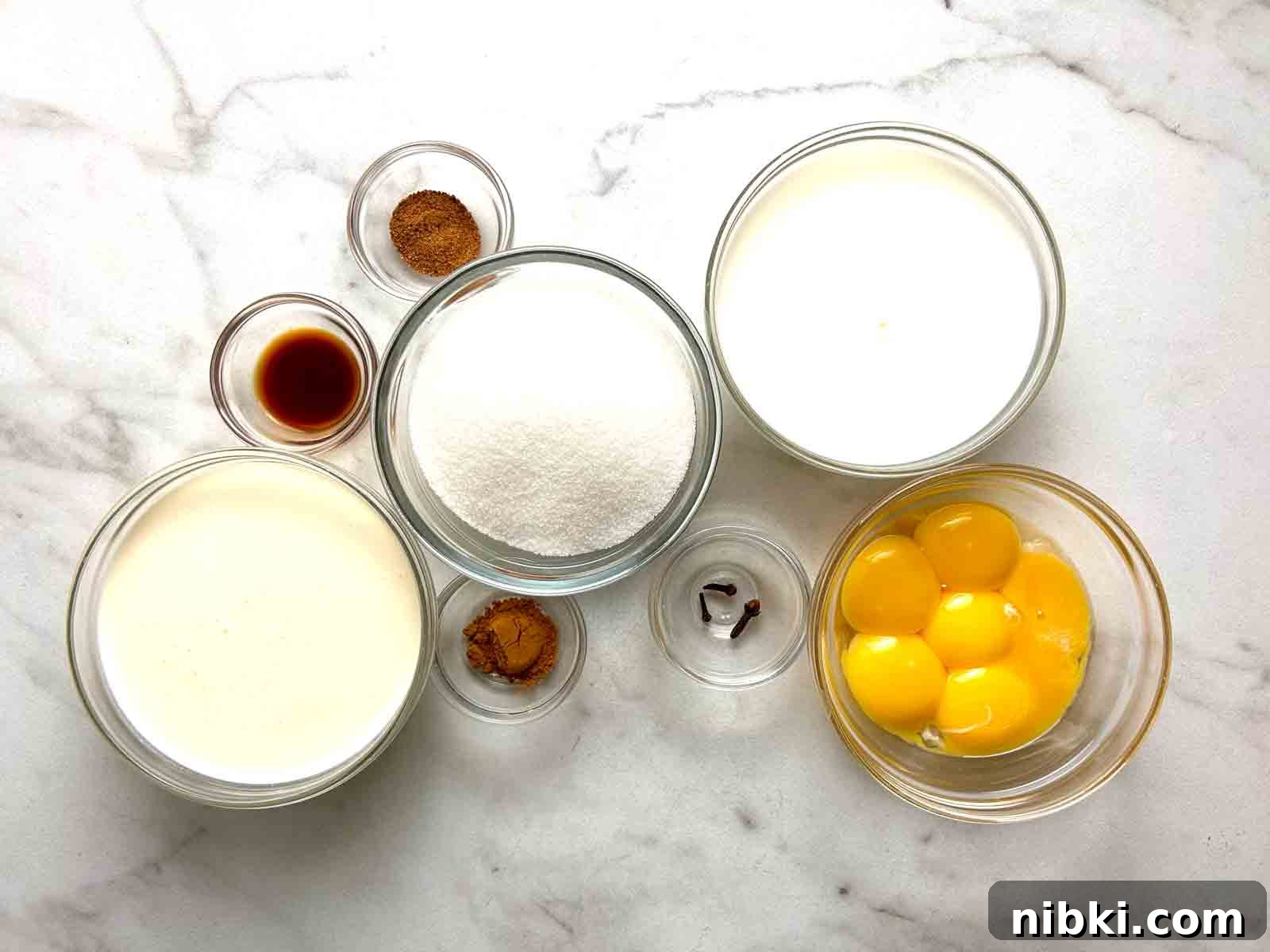 How to Make Classic Homemade Eggnog with Rum 3 ingredients prepped in bowls.