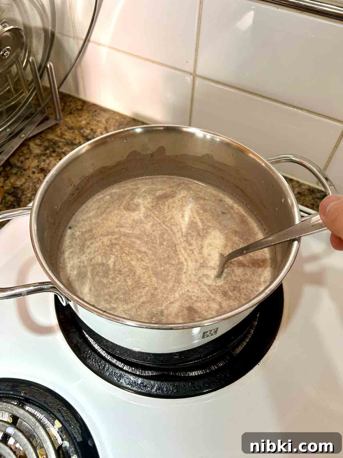 How to Make Classic Homemade Eggnog with Rum 5 milk and cream mixture brought to simmer.