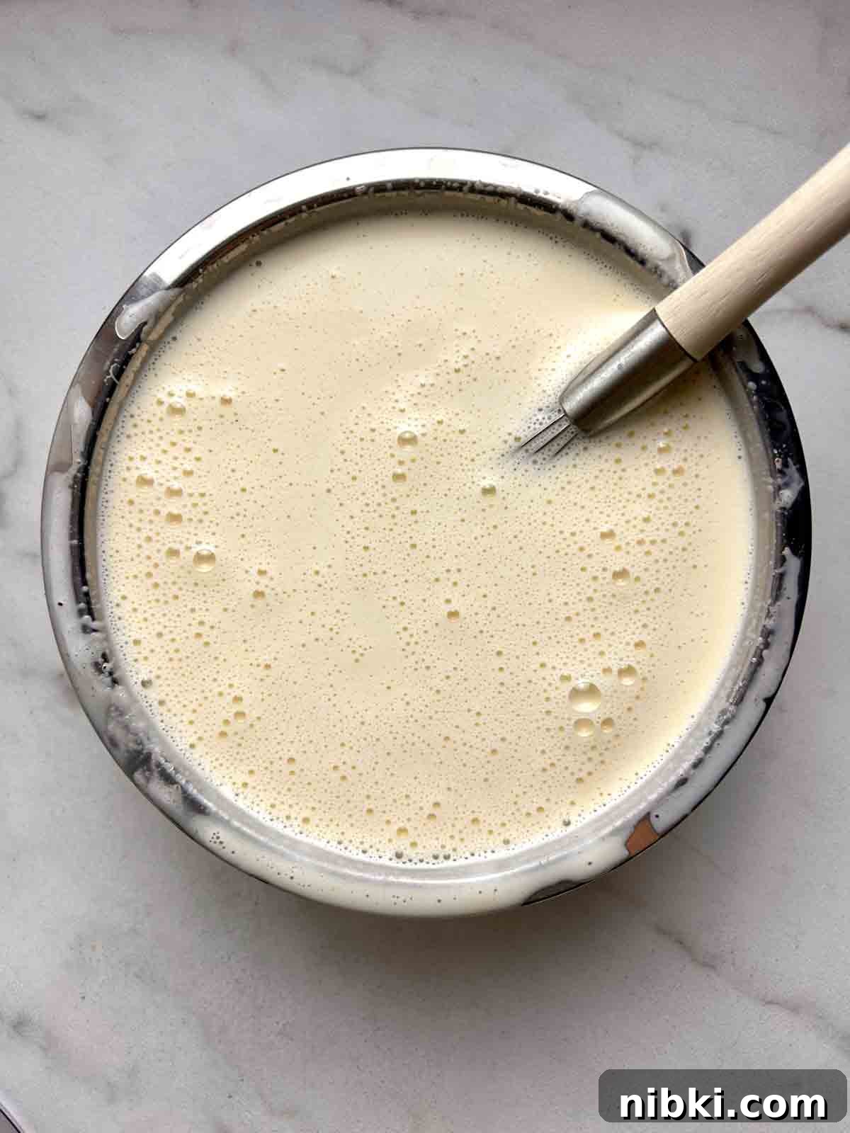 How to Make Classic Homemade Eggnog with Rum 6 milk mixture whisked into egg mixture.