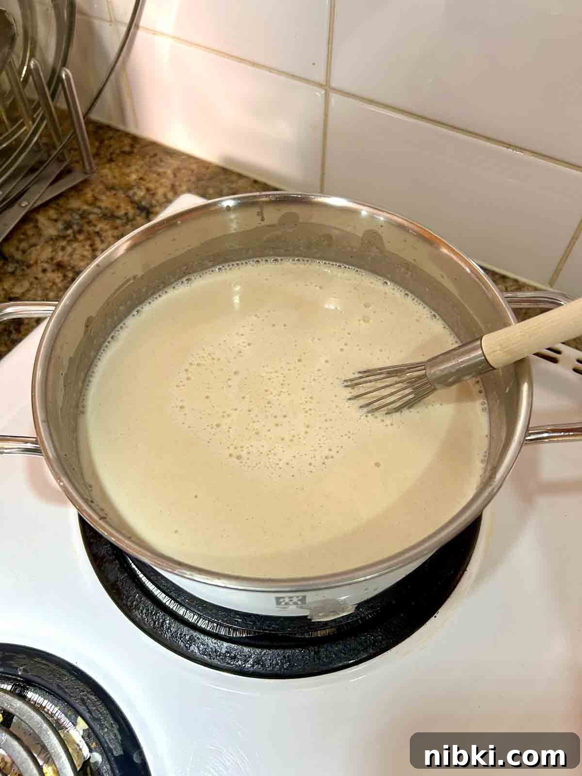 How to Make Classic Homemade Eggnog with Rum 7 egg mixture poured back into pot and brought to a simmer.