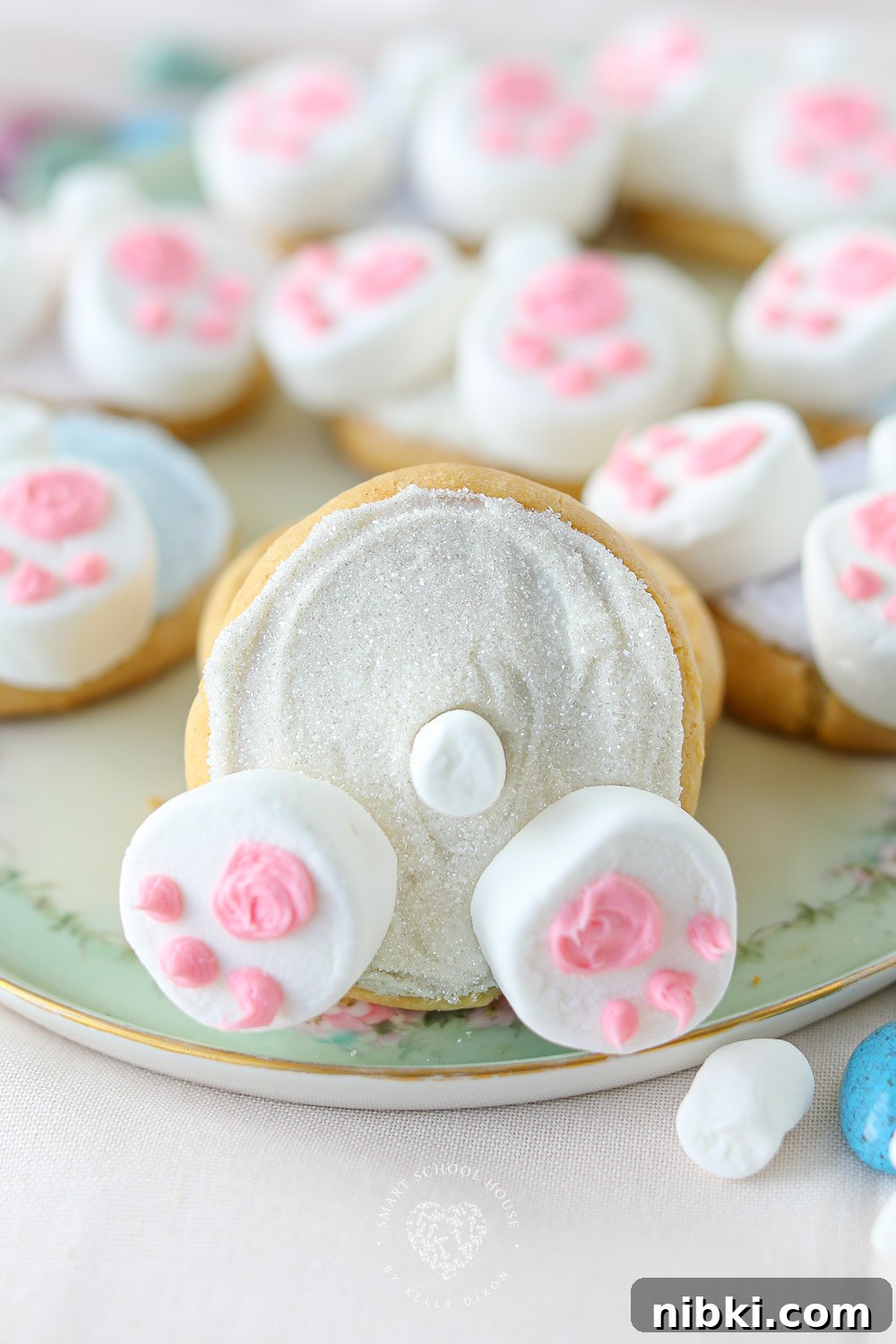 Bunny Butt Cookies are frosted Easter cookies that feature little bunny paws made with marshmallows and a little white marshmallow tail.