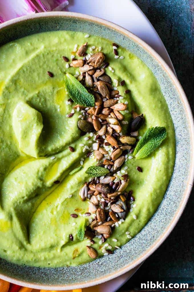 Green pea hummus with olive oil.
