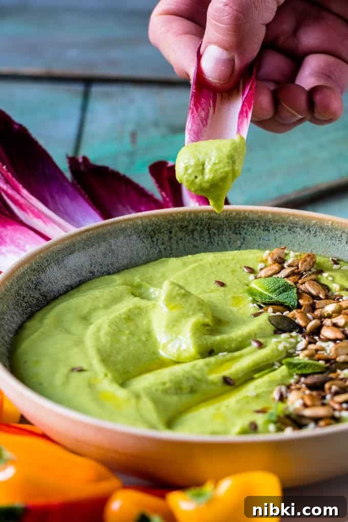 Green pea hummus with olive oil.