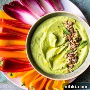 Green pea hummus with olive oil.