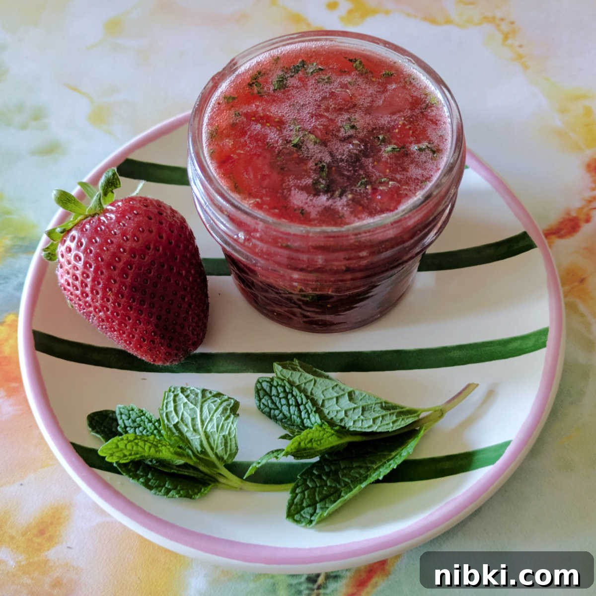 Homemade Strawberry Mint Jam Without Pectin 6 jar of strawberry mint jam on plate