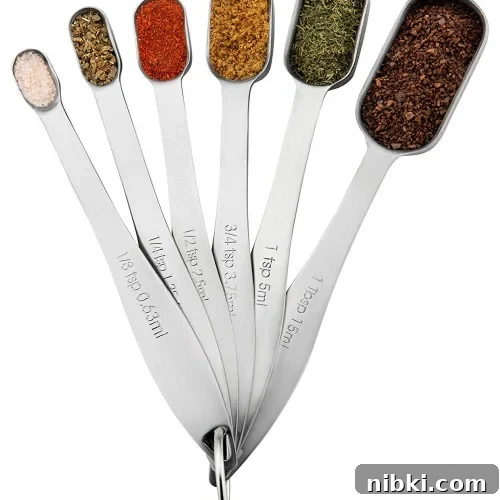 A set of metal measuring spoons.