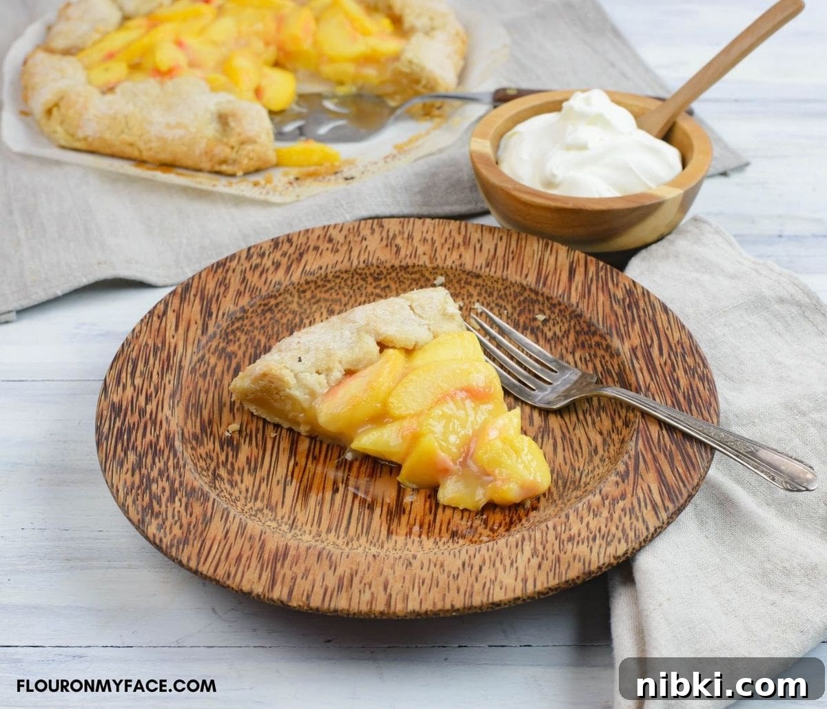 A slice of peach pie on a plate.