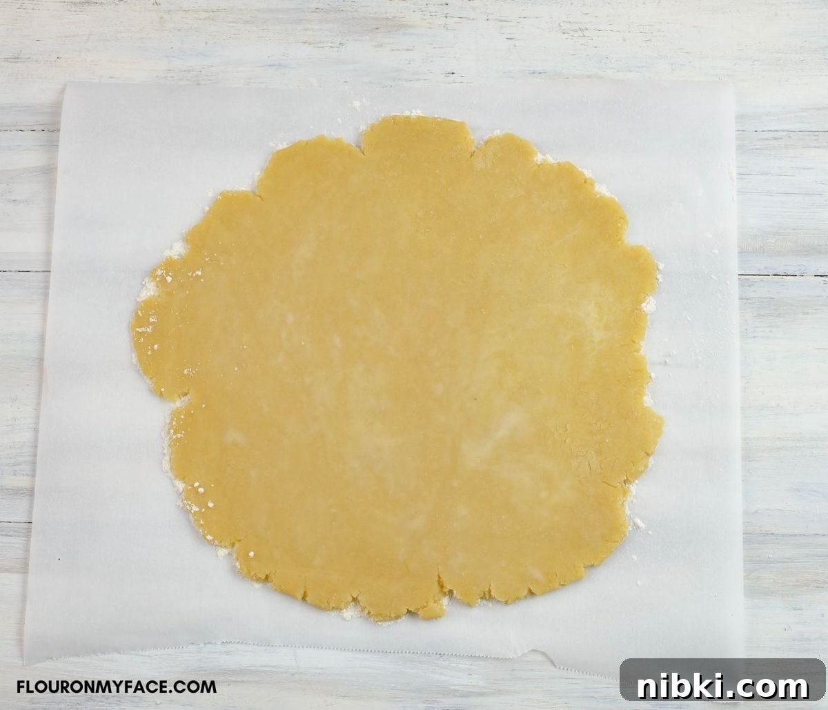 A rolled out pie crust for a rustic peach pie.