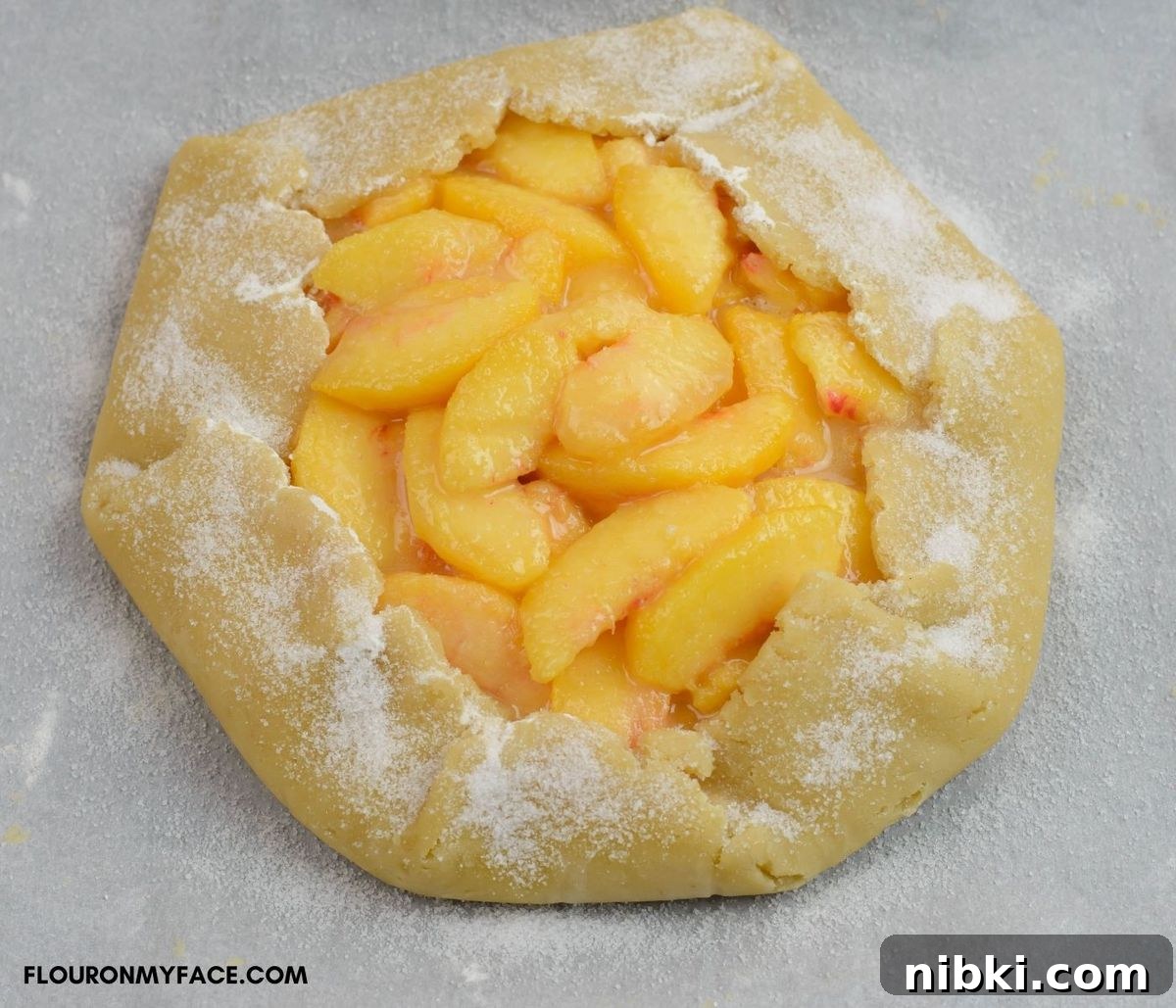 A rustic pie crust sprinkled with sugar.