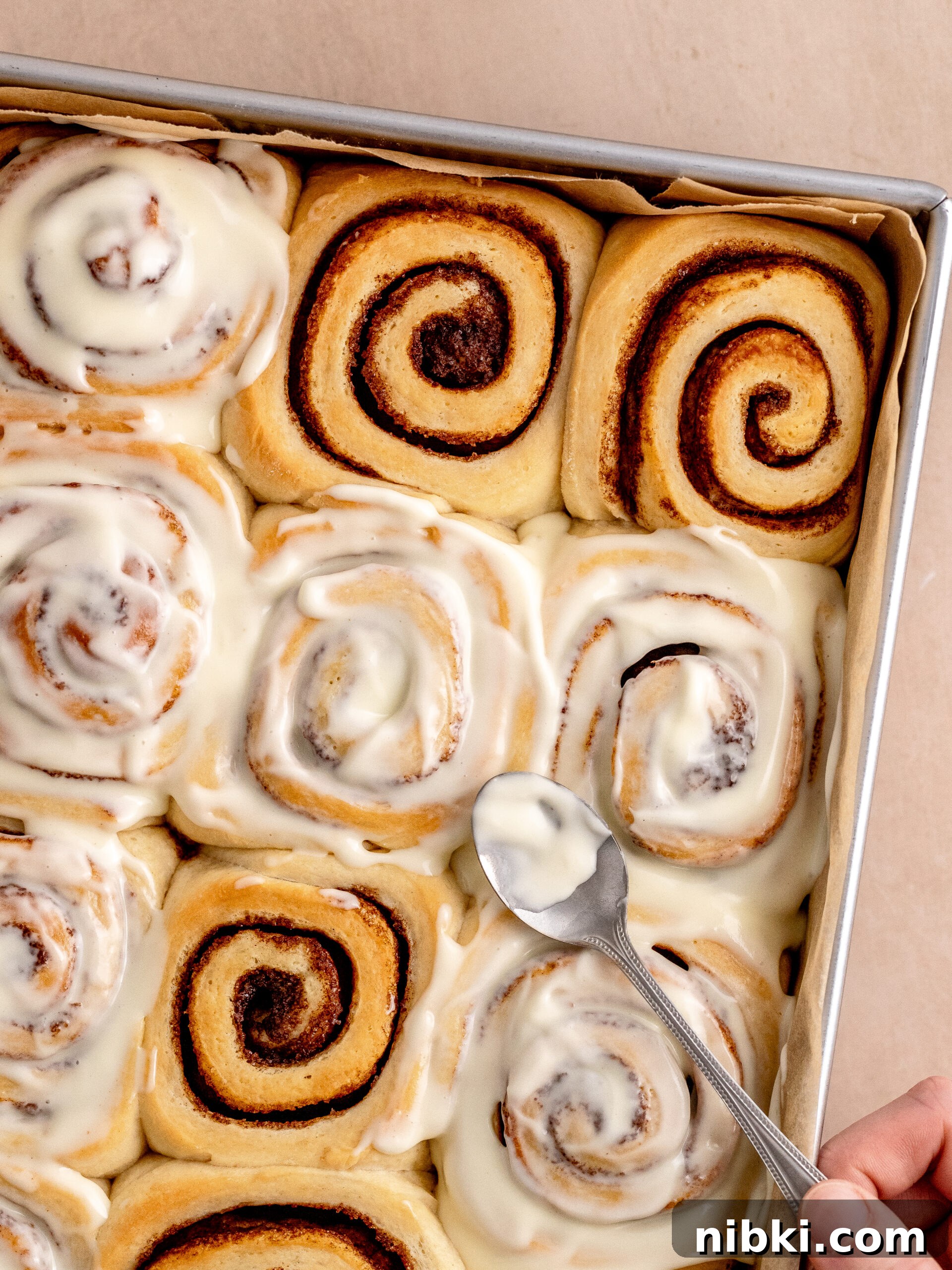 Brioche Cinnamon Rolls Recipe with Vanilla Glaze 8 Frosting spread over the brioche cinnamon rolls.
