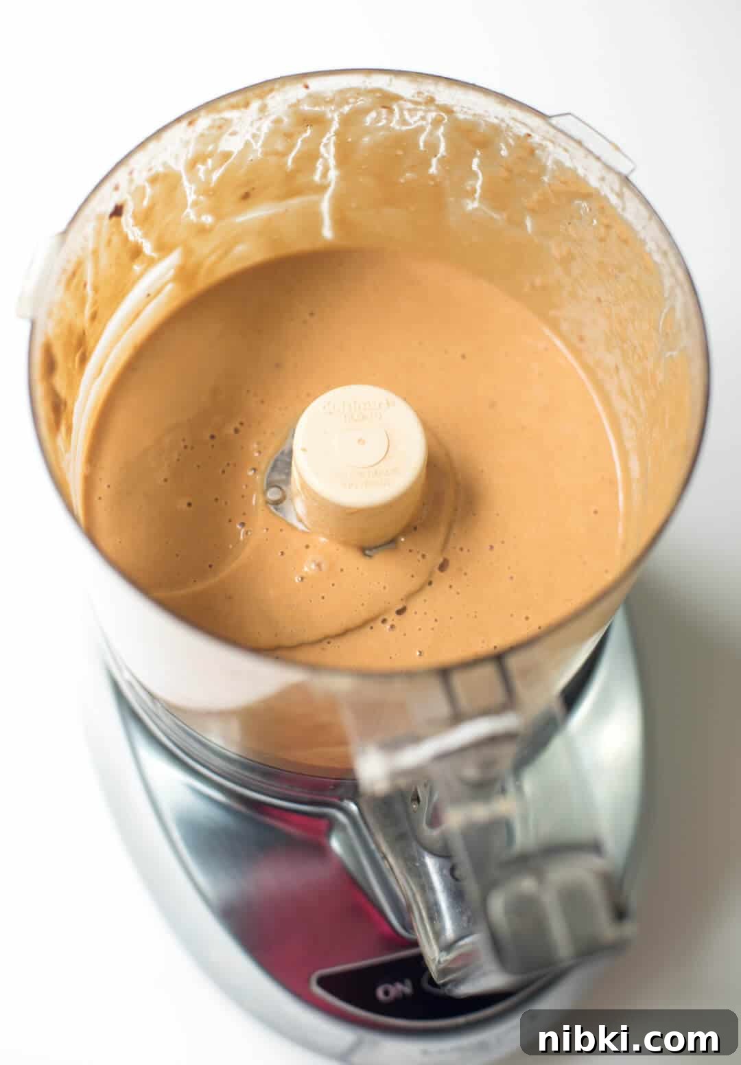 Peanut sauce after being blended in a food processor.