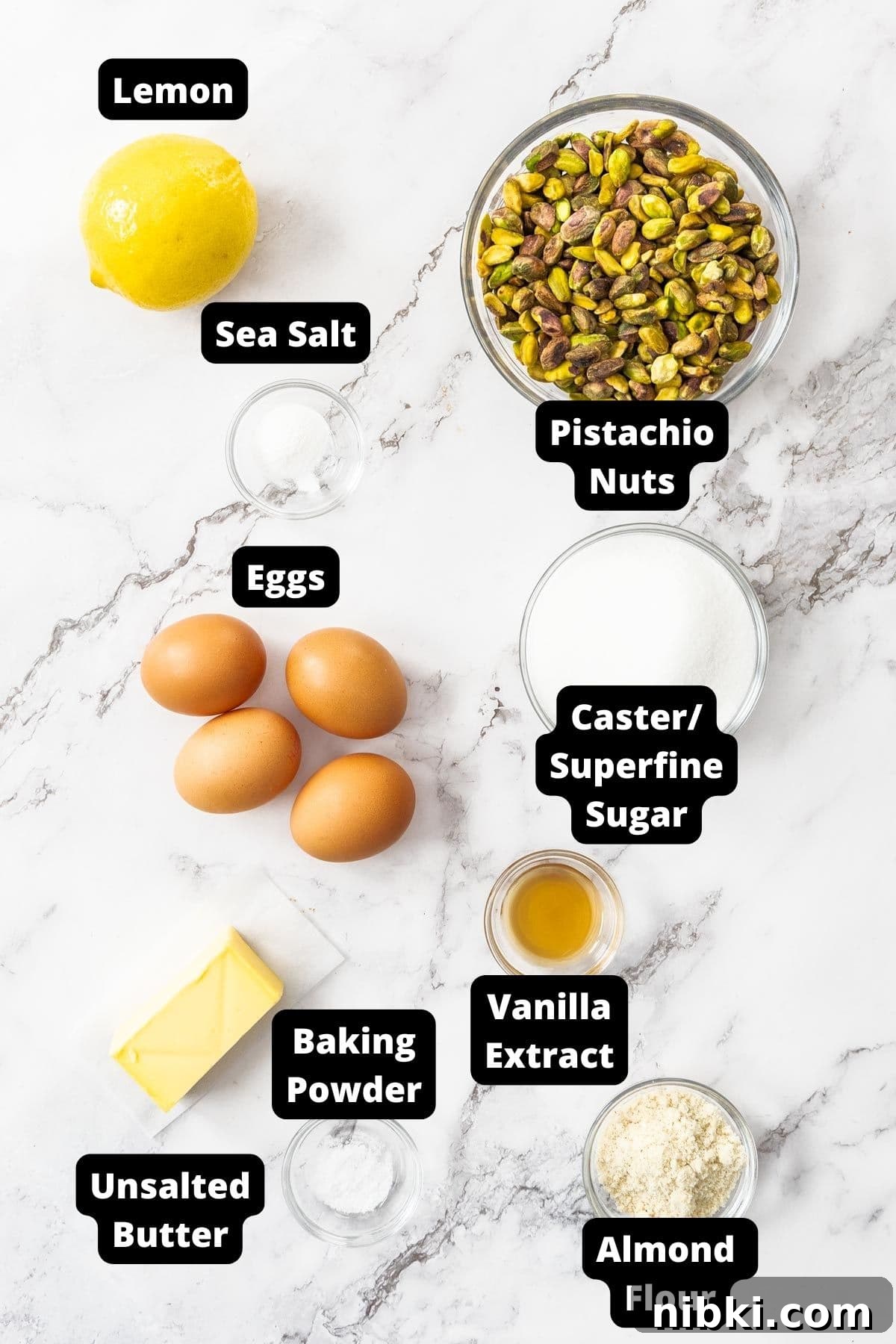 Decadent Flourless Pistachio Cake Recipe: Gluten-Free Dessert 3 Ingredients for Flourless Pistachio Cake on a white marble background.