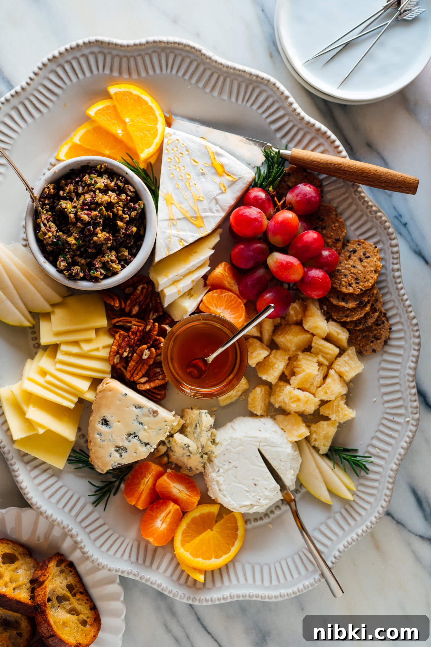 Homemade Olive Tapenade Recipe with Garlic and Capers 5 tapenade on cheese plate