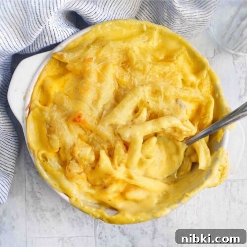 mac and cheese in casserole dish with spoon in dish