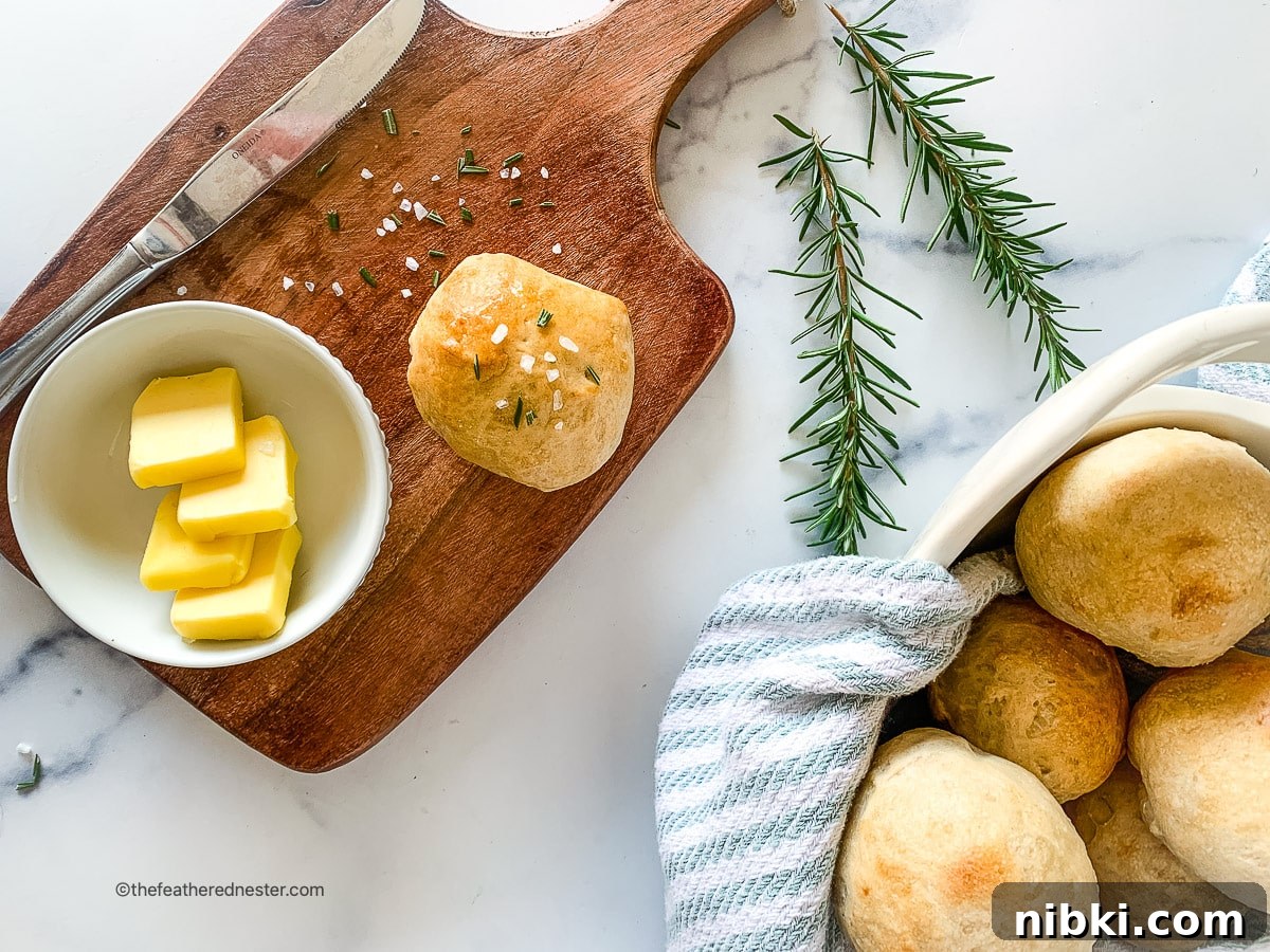 Horizontal photo of sourdough rolls on a basket and a wooden board.
